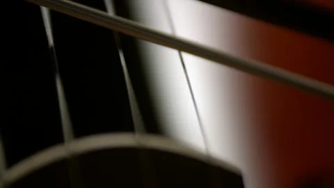 Cello strings and bow, Macro closeup. Concept of playing violoncello. Symphony Stock Footage 152065900