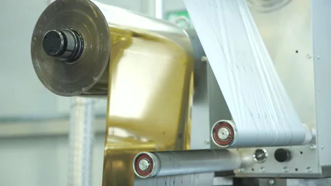 Cellophane is moving between the shaft. Video stock 245024629