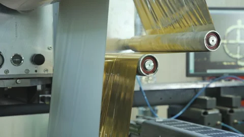 Cellophane is moving between the shaft. Video stock 245024970