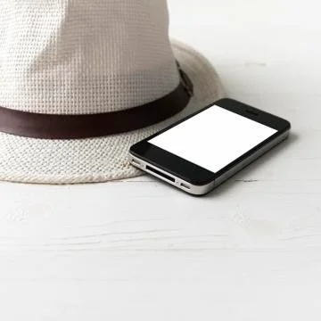 Cellphone and hat Stock-Fotos