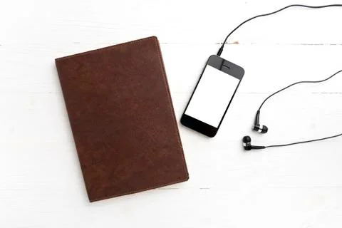 Cellphone and notebook Stock Photos