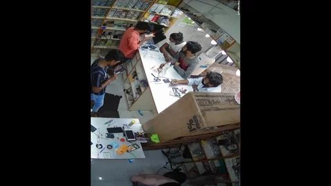 Cellphone battery explodes while being sanitised during repair at shop in India Video stock 273024337