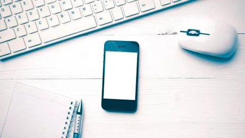 Cellphone with computer and coffee cup vintage style Stock Photos