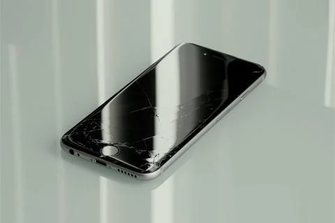 Cellphone with cracked screen on. Stock Photos