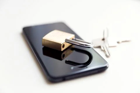 Cellphone data security - lock, keys and phone on white background Stock Photos