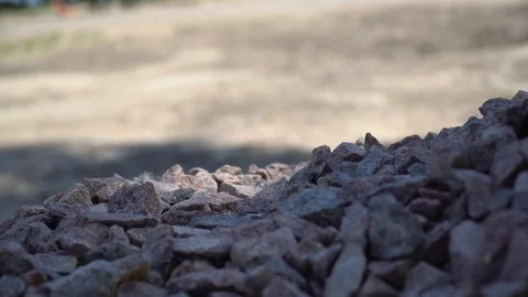 Cellphone in heap of pebble. Unbreackable touchscreen of mobile phone Stock Footage 109161373