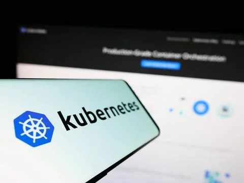 Cellphone with logo of container orchestration system Kubernetes on screen... Foto stock
