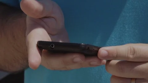 Cellphone reading 스톡 동영상 73189704