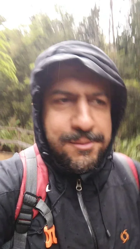 Cellphone vertical video from a man walking and talking directly to camera while Stock Footage 161079397