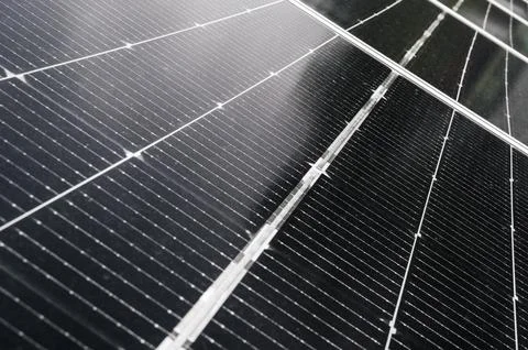 Cells of modern black solar panel close up. Green renewable energy Stock Photos
