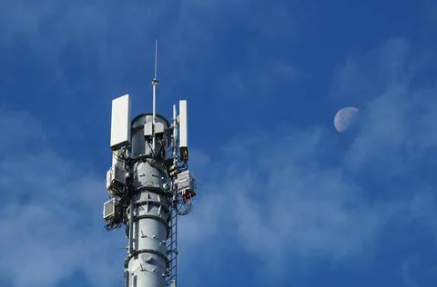 Cellular 5G network technology mobile telecommunications tower with mounted Stock Photos