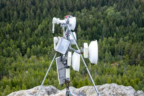 Cellular antenna installed high in the mountains Stock Photos