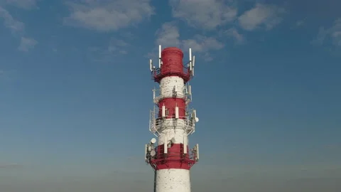 The cellular antennas are installed on a factory pipe. Stock Footage 162984656