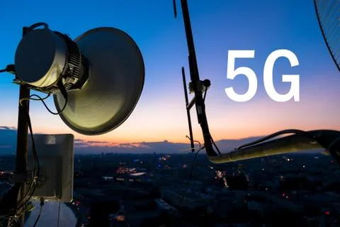 Cellular communications tower close-up is on the background of the evening ci Stock Photos