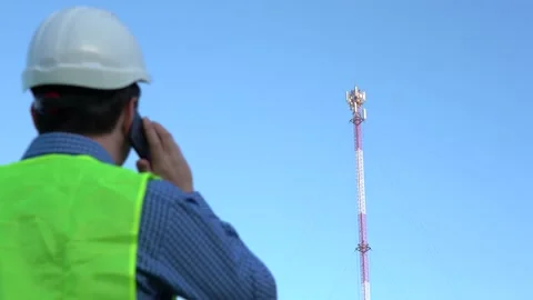 Cellular Engineer next to the Mast Video stock 154391216