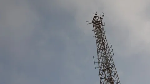 Cellular LTE communication tower against the blue sky with fast moving clouds -  Stock-Footage 109403808