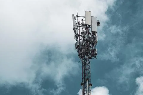 Cellular network tower with antennas in clouds 스톡 사진