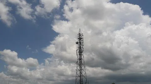 Cellular tower with clouds Stock Photos