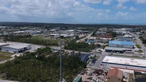 Cellular Tower Within Commercial and Industrial Business Area, Bahamas Aerial Stock Footage 90105624