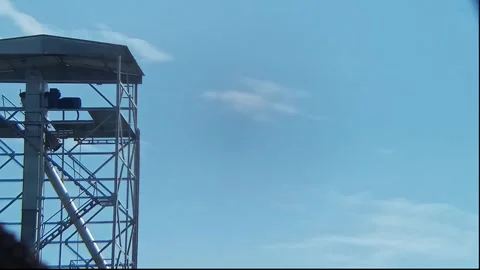 A cellular transmitter tower and blue sky Stock Footage 310194164