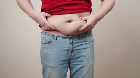 Cellulite and fat on the stomach of an elderly woman. 库存影片 144089604