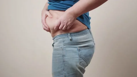 Cellulite and fat on the stomach of an elderly woman. 库存影片 144089623