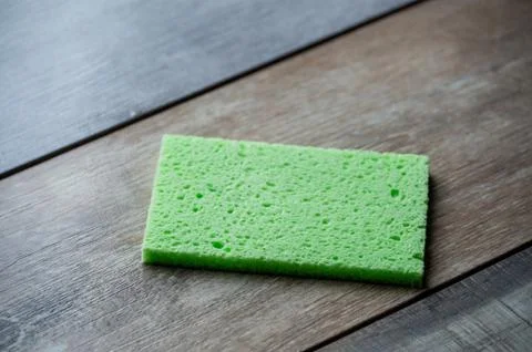 Cellulose sponge kitchen objects on the wood texture background. Cellulose na Stock Photos