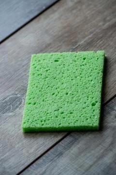 Cellulose sponge kitchen objects on the wood texture background. Cellulose na Stock Photos