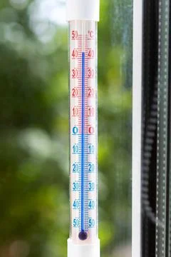 A Celsius thermometer shows high temperatures during heat waves outside Stock Photos