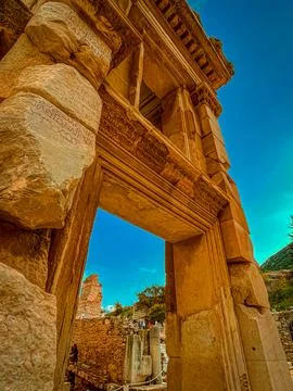 Celsus Library Archway Frames Azure Sky Amid Inscribed Stone Blocks Stock Photos