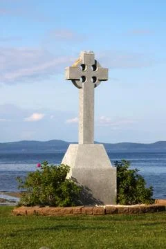 Celtic cross by ocean Stock Photos