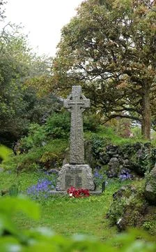 Celtic Cross War Memorial Surrounded by Bluebells and Wreaths in  .. Stock Photos