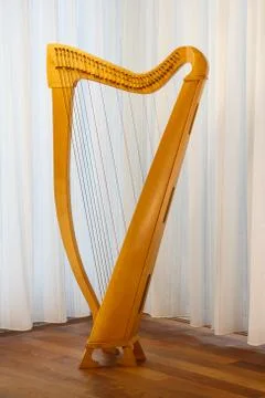 A celtic harp with strings standing. ready to play. Stock Photos