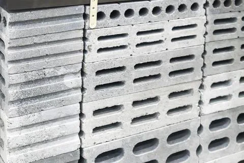 Cement brick blocks used in structural wall construction with holes inside .. Stock Photos