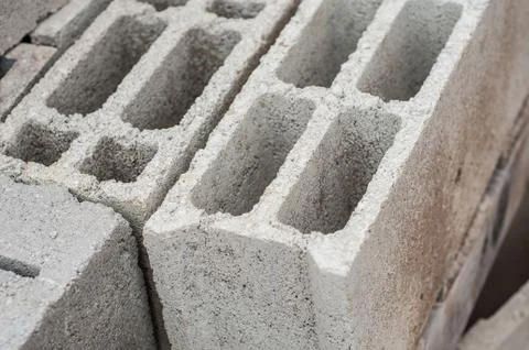 Cement bricks pile in construction site Stock Photos