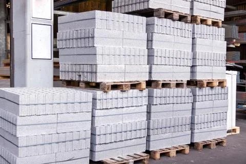 Cement building blocks stacked on pallets Stock Photos