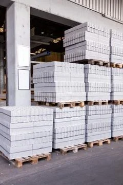 Cement building blocks stacked on pallets Stock Photos