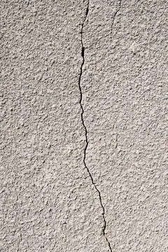 Cement crack on the wall surface. Cement texture for background. Stock Photos