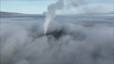 Cement Factory chimney stack above fog in town Video stock 293766513