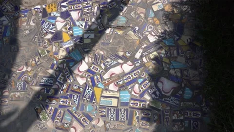 A cement floor with several pieces of ceramic embedded in the sun in a country Stock Footage 161935756