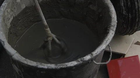 Cement is mixed in a bucket 스톡 동영상 112121738