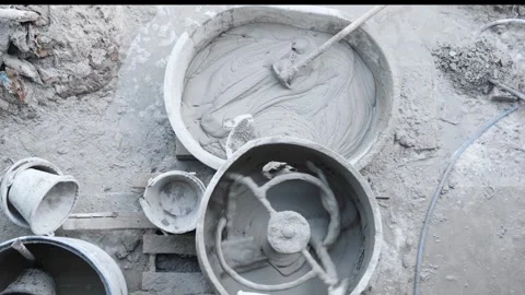 A cement mixer is rotating to blend sand cement and water into concrete the.. Stock Footage 300075786