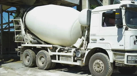 The Cement mixer truck during loading Stock Footage 65743143