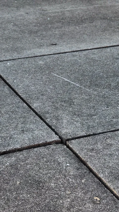 Cement outdoor pavement with square slabs and expansion joints Stock Footage 332365243