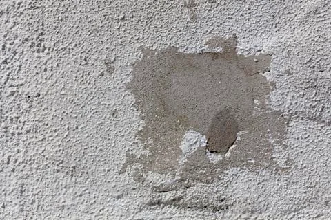 Cement patch on white old wall. Stock Photos