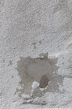 Cement patch on white old wall. Stock Photos