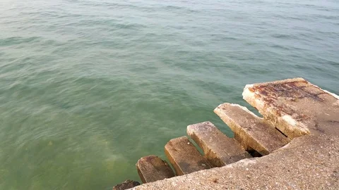 Cement pier in the sea with worn steps, Peraia Thessaloniki area, Greece Stock Footage 118994124