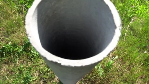 Cement pipe sticking out of the ground Stock Footage 75915561