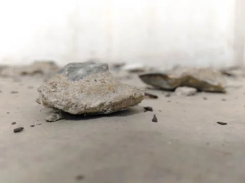 Cement plaster and broken down on the floor. Stock Photos