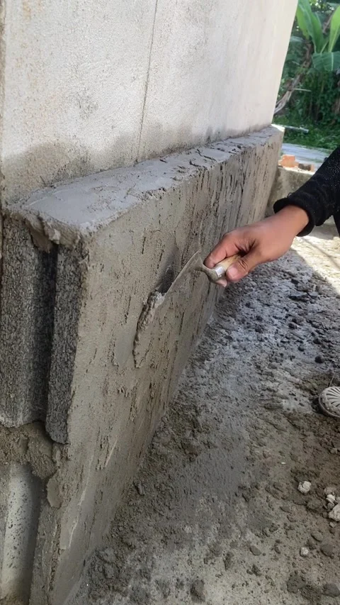 Cement plaster on brick wall construction Video stock 332567447